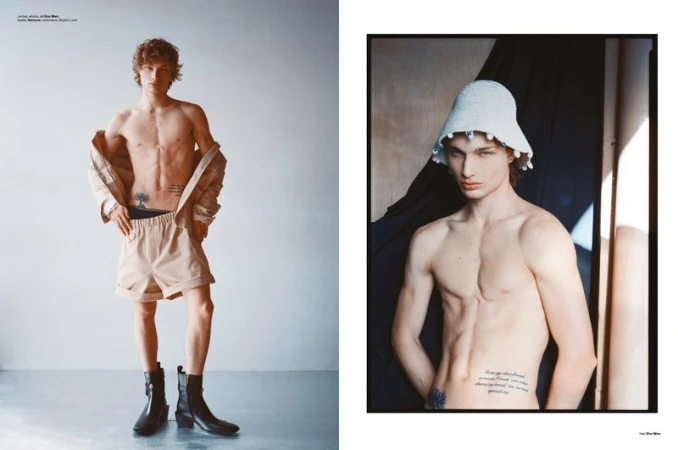 Fashion editorial of a shirtless male model in beige shorts, black boots, and a jacket; a second image shows him wearing a knitted hat.