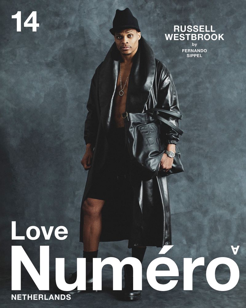 Russell Westbrook wearing an open black leather coat, black hat, and holding a black leather bag for Numéro Netherlands cover.