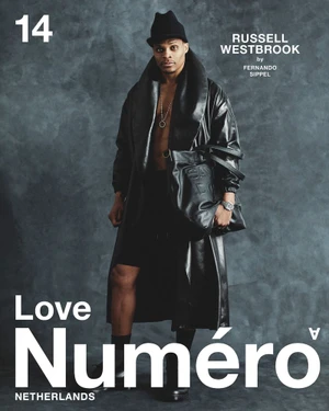 Russell Westbrook wearing an open black leather coat, black hat, and holding a black leather bag for Numéro Netherlands cover.