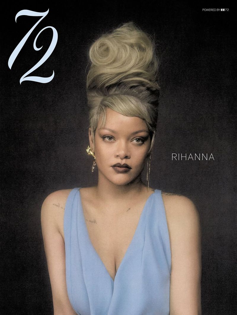 Rihanna wearing a light blue dress with an elaborate high blonde updo against a dark background for 72 Magazine.