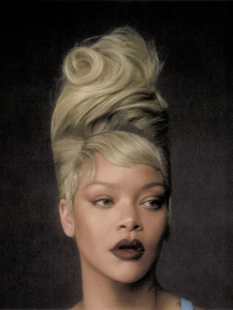 Portrait of Rihanna with high sculpted blonde updo and dark lipstick against dark textured background