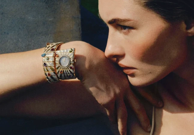 Close-up profile of model Grace Elizabeth wearing an ornate gemstone watch and bracelet for Vogue Turkey