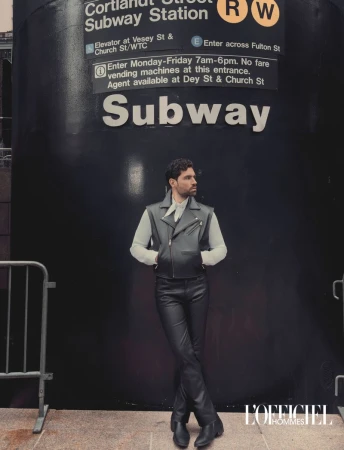 Model Emanuele Antonio Panico in a black leather vest and pants standing outside the Cortlandt Street Subway Station entrance.