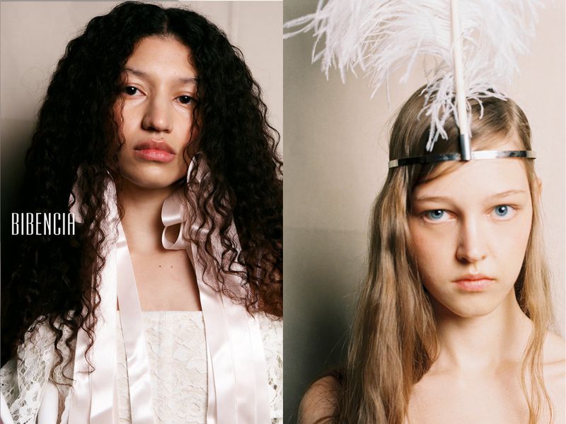 Side-by-side portraits of two models, one with curly dark hair and ribbons, the other wearing a feathered silver headband.