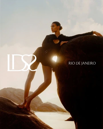 Model Barbara Valente posed barefoot on coastal rocks during golden hour for Ludovic de Saint Sernin in Rio de Janeiro.