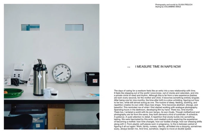 Still life photo of an analog clock, stainless steel thermos, and containers on a white table, capturing a quiet, minimalist aesthetic.