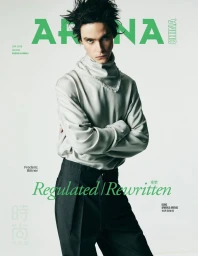 Model Frederic Bittner wearing a draped light grey high-neck top and black trousers on the Arena Homme+ China cover.