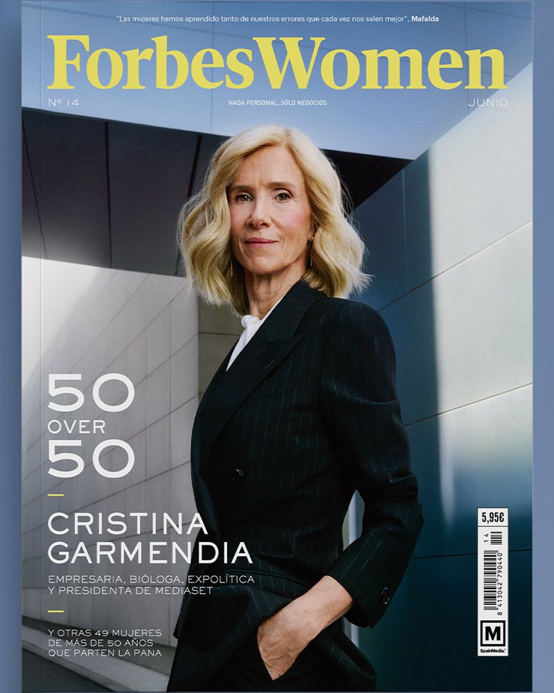 Forbes Women magazine cover featuring Cristina Garmendia in a pinstripe suit, against a modern building backdrop, promoting the '50 Over 50' issue.