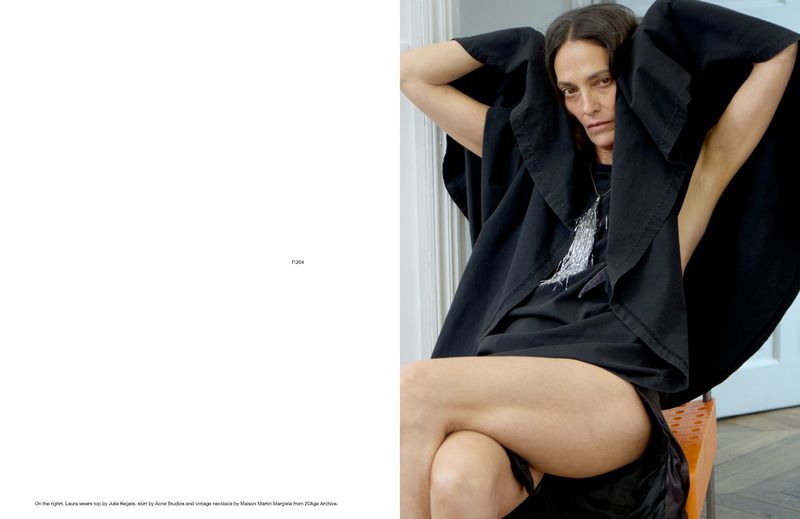 A photograph presents a woman in a black outfit seated indoors, her gaze directed at the camera with a neutral expression, bathed in natural light.