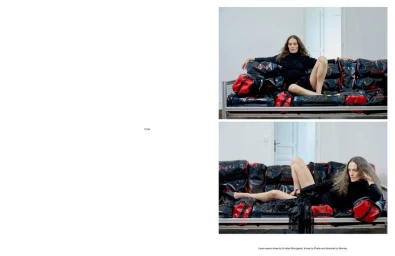 Model Laura Ponte posing in black apparel on a modular sofa made of black and red duffle bags for an Endless Magazine editorial.