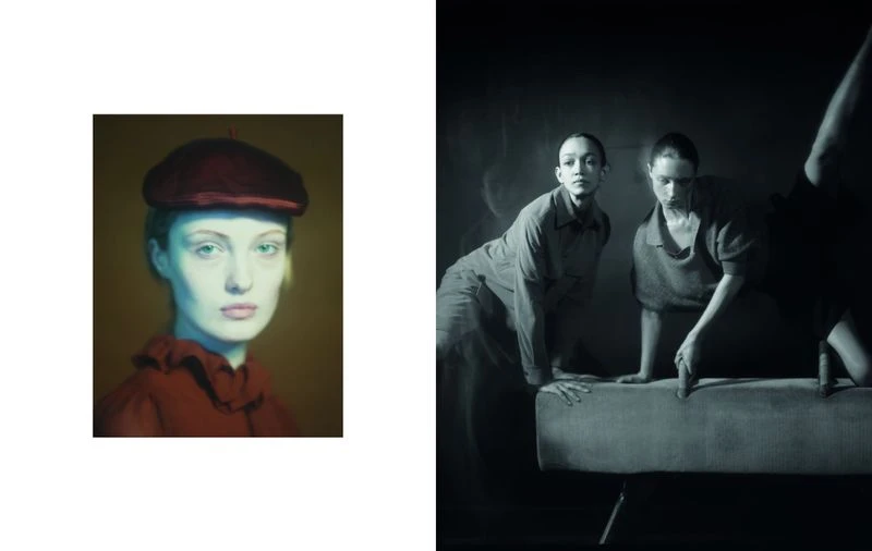 Two women in uniform with dark lighting performing synchronized movement near a pommel horse; a painting of a woman is shown in contrast.