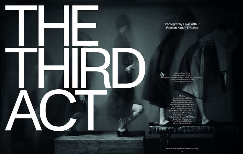 Monochromatic fashion editorial photo with three women in dresses and coats, styled for a dark and conceptual look.