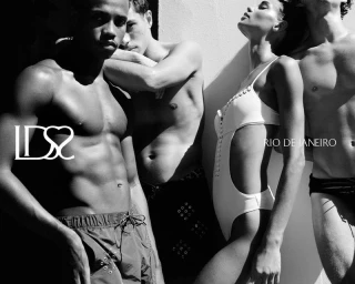 Four models posing in swimwear under harsh sunlight and sharp shadows in a high-contrast black and white shot.