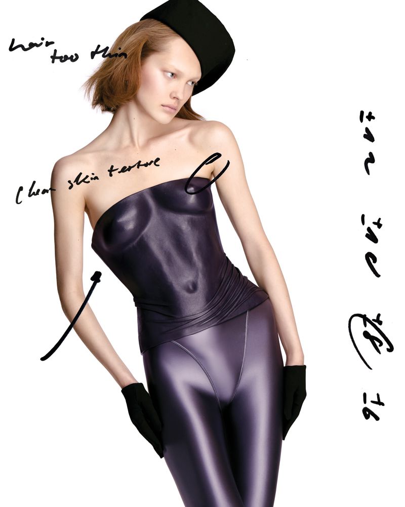 Model in metallic purple molded bodysuit and black gloves with handwritten editorial notes on clean white background