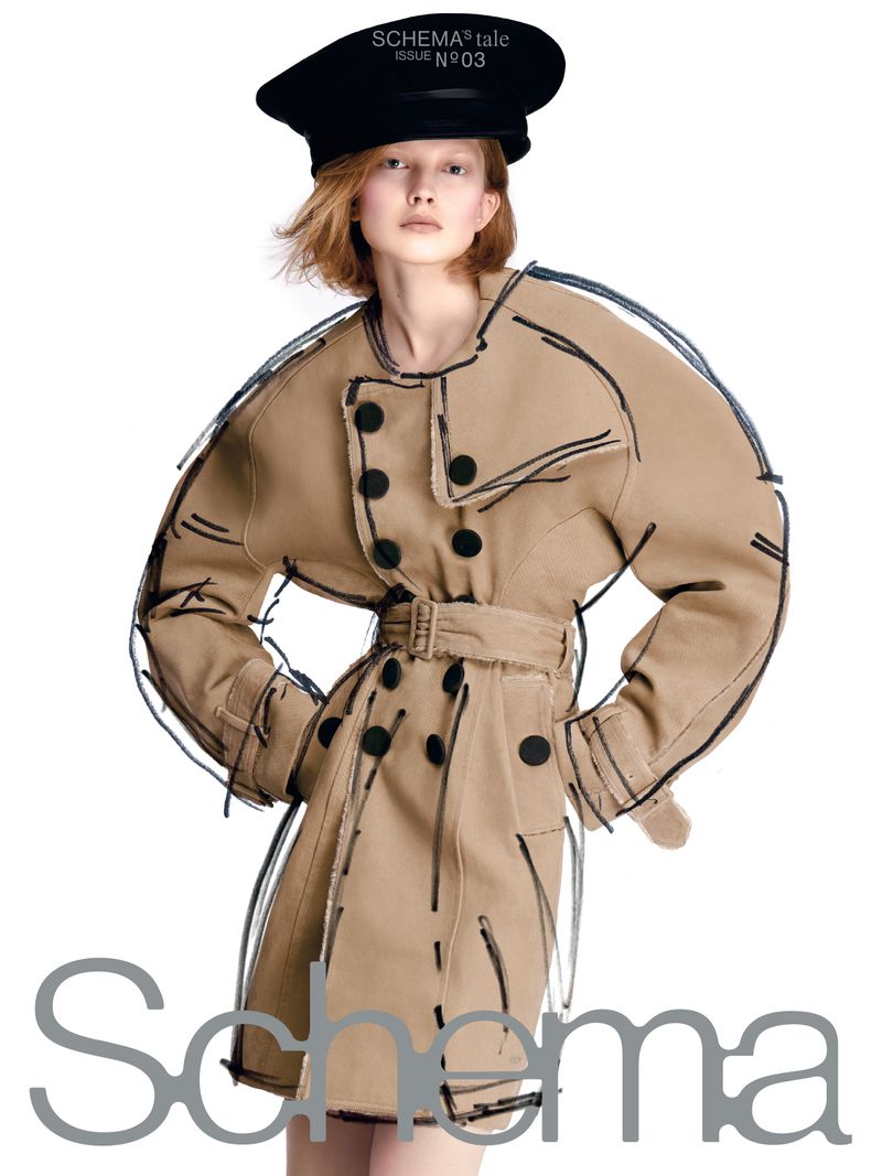 Model Viktoria Wirs wearing a belted beige trench coat and large black cap with sketched black line overlays against white.