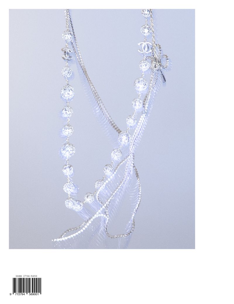 Elegant necklace with beaded strands and Chanel logos isolated against a softly lit background for fashion and jewelry concepts.