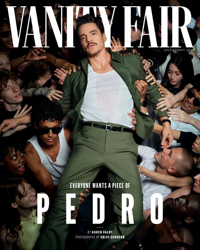 Vanity Fair magazine cover featuring Pedro Pascal in an olive suit surrounded by reaching fans under bright lighting in a studio.