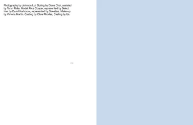 Minimalist magazine spread with editorial credits printed in black text on white next to a solid light blue page.