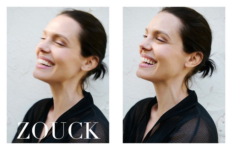 Diptych side-by-side portraits of a smiling woman with dark hair tied back wearing a black mesh top against an off-white wall.