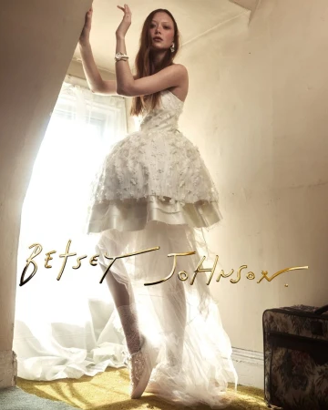 Sara Grace Wallerstedt wearing a white bridal dress for the Betsey Johnson 2026 Bridal Campaign