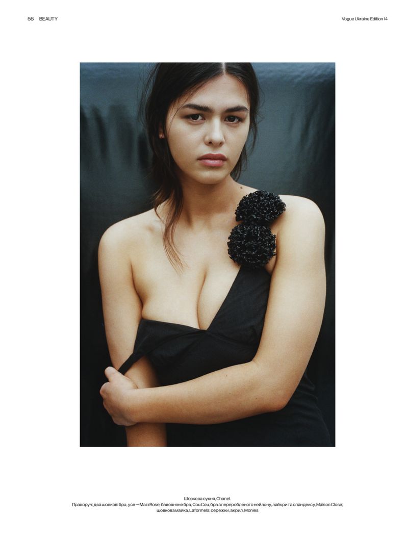Model Noor Mutsaers wearing a black off the shoulder dress with shoulder embellishment for Vogue Ukraine.