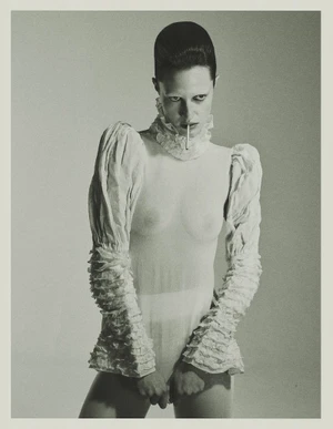 Model Julia Banas in a white ruffled top holding a cigarette for Tidal Magazine, photographed by Edyta Chachulska