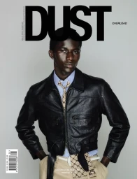 Model Mohammed Banze in a black cropped leather jacket and patterned tie on the cover of Dust Magazine Issue 29.