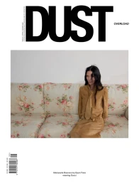 Model Mariacarla Boscono seated on a floral patterned sofa in a magazine cover layout for Dust Magazine