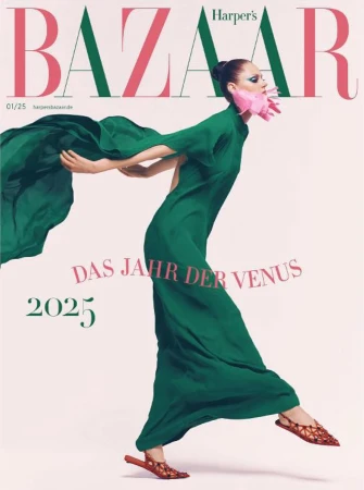 Magazine cover featuring a woman in a flowing green dress and matching shawl, complemented by pink floral accents near the face.