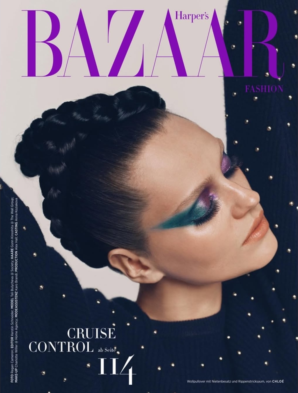 Fashion magazine cover featuring a model with creative makeup, intricate braided hair, and a black top with silver embellishments.