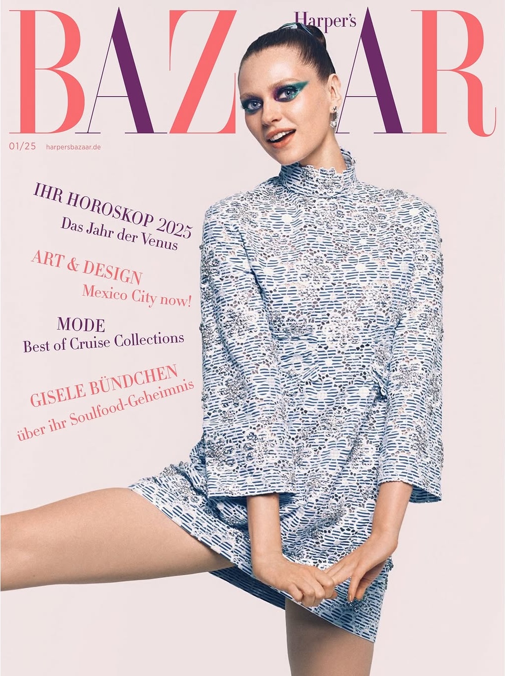 Fashion magazine cover featuring a smiling woman in patterned mini dress and green eyeshadow, against a light pink background with masthead.
