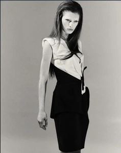 Model Wilda Rubin posing in a structured two-tone black and white sleeveless dress against a neutral studio backdrop.