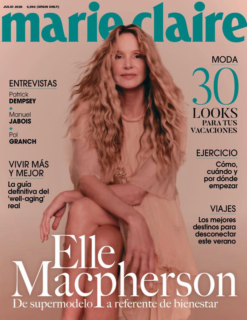 Model Elle Macpherson seated on a seamless backdrop wearing a light dress for Marie Claire Spain cover