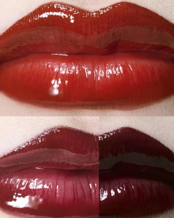 Extreme close-up of glossy lips displaying three swatches of bright red, deep crimson, and dark burgundy lipstick.