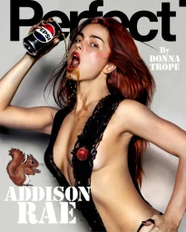 Addison Rae pouring soda from a can onto her face wearing a black lace outfit for Perfect Magazine cover
