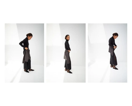 Triptych of Romae Gordon posing in a black turtleneck and draped leather accent piece against a white studio background.