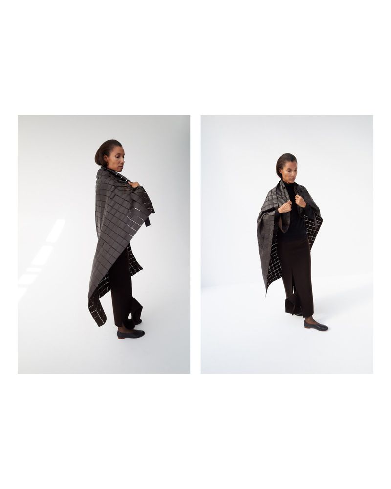 Model Romae Gordon wearing a dark grid-patterned wrap shawl and black skirt in a studio diptych for Freya Dalsjo.