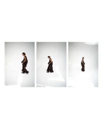 Triptych of model Romae Gordon in a dark sleeveless ruffled ensemble walking across a bright white studio floor.