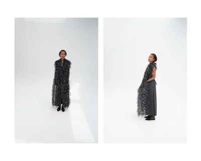 Two studio portraits of a model wearing a textured fringe sleeveless black garment over grey trousers against a white seamless background.