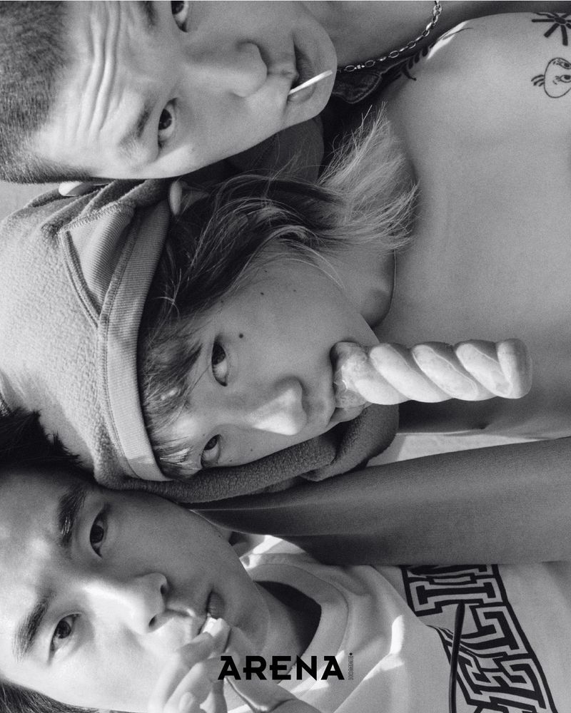 Three Asian individuals close together, two men and a woman, share sugary treats in a black and white composition for a magazine cover.
