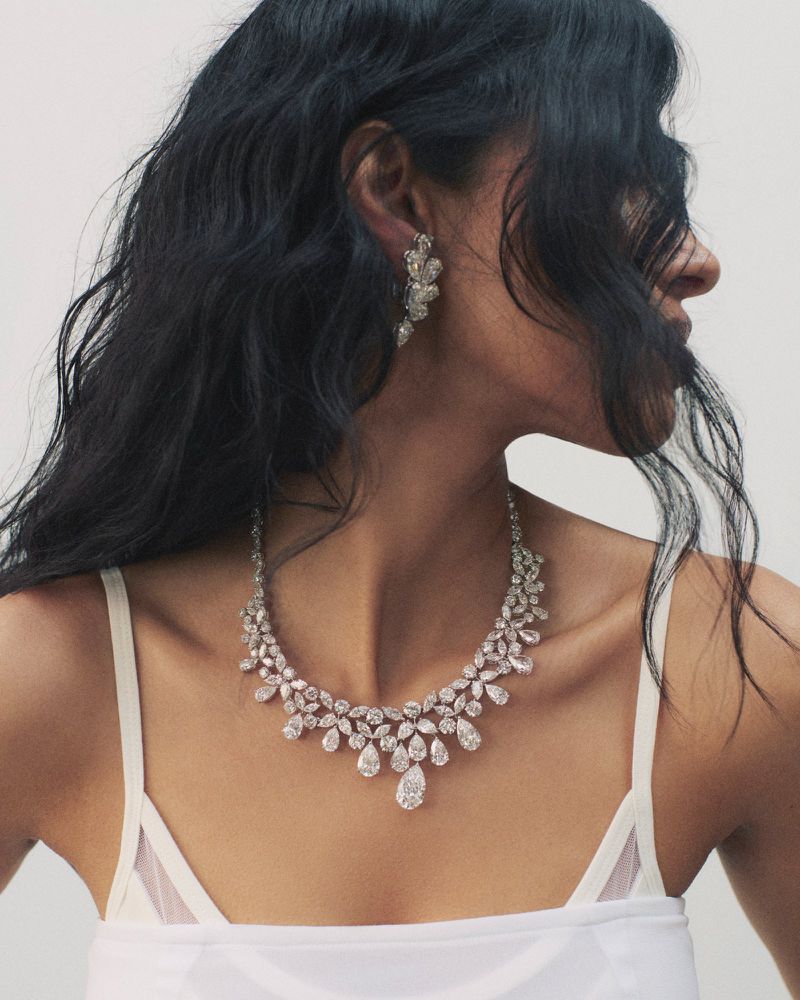 Close-up portrait of model Pooja Mor wearing a diamond necklace and earrings for Financial Times HTSI Magazine