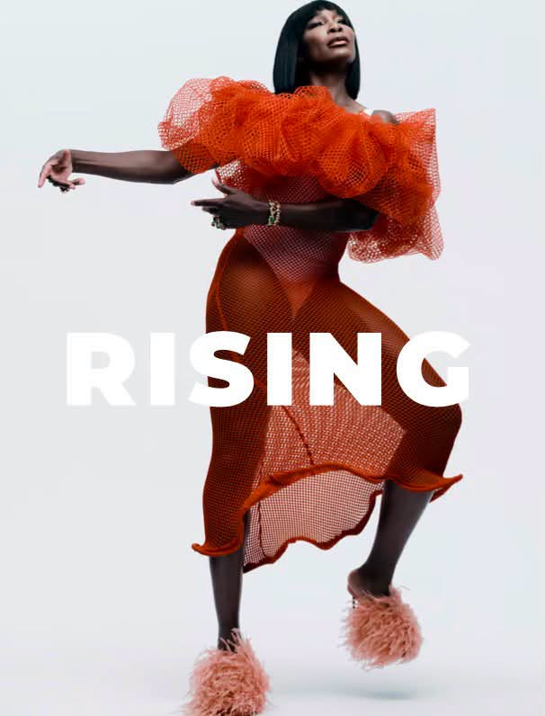 Venus Williams wearing an orange sheer mesh dress and feathered mules against a white seamless background for Grazia UK