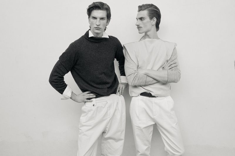 Two male models posing against a white seamless background for the Petals campaign by Issue South America, photographed by Massimiliano Gallus.