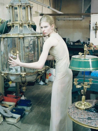 Model Victoria Volt in a long neutral dress posing beside an ornate glass lantern for WRPD Magazine