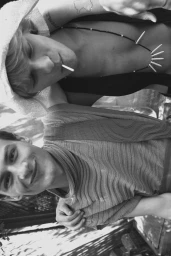 Black and white portrait of models Isaac Kaplan and Audi Bizar posing together outdoors for Harper's Bazaar Thailand Men.