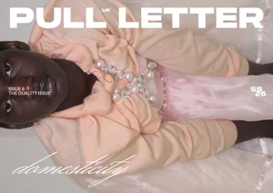 Model Nyagoa Diu wearing a peach hooded top with pearl embellishments and a sheer skirt for Pull Letter Magazine.