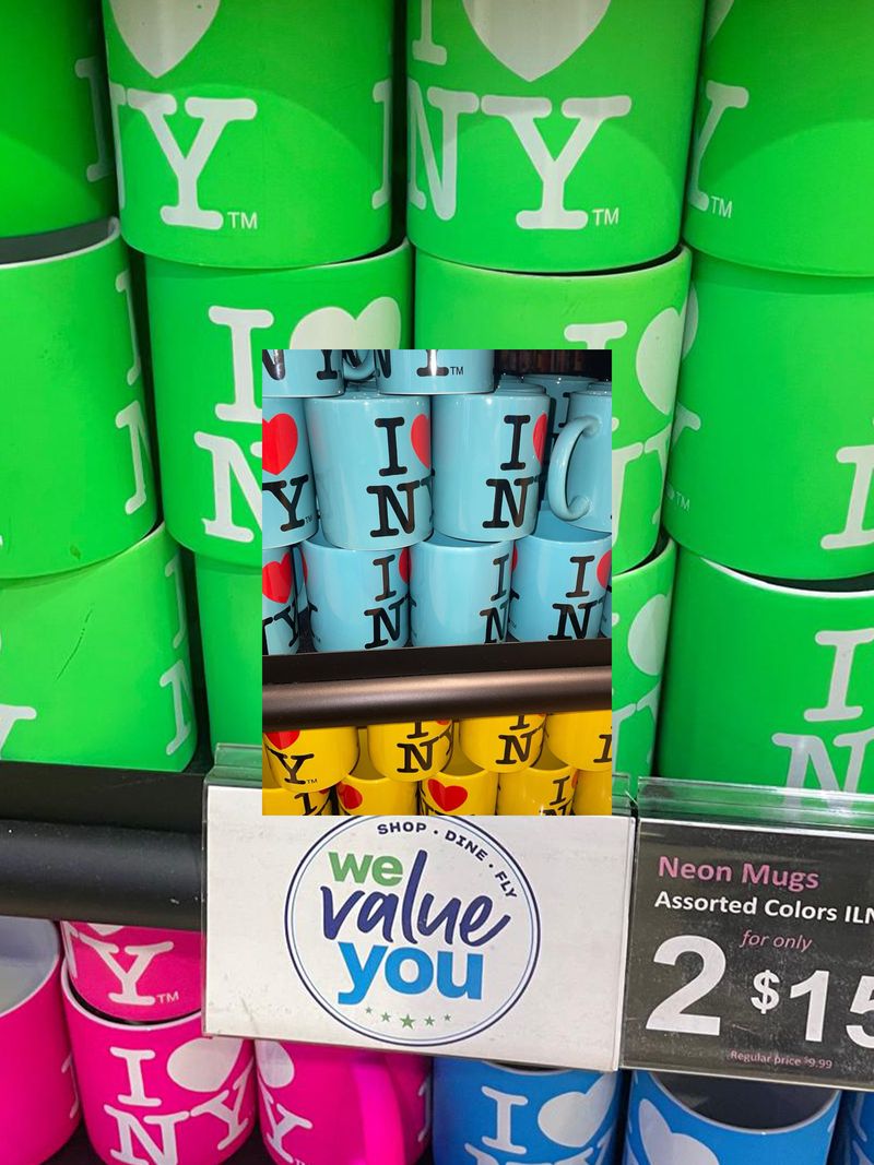 Close-up of vibrant neon souvenir mugs printed with I Love NY text stacked on retail shelves with a layered inset image.
