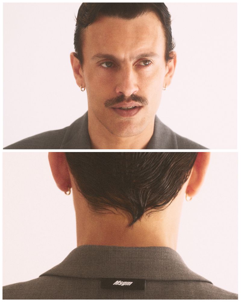 Split diptych portrait showing front and back views of a man with slicked dark hair, mustache, and hoop earrings in a grey jacket.