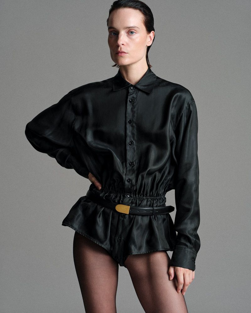 Model Charlotte Tomas wearing a black silk blouse and shorts styled by Julie Pelipas for BETTTER F/W 2026