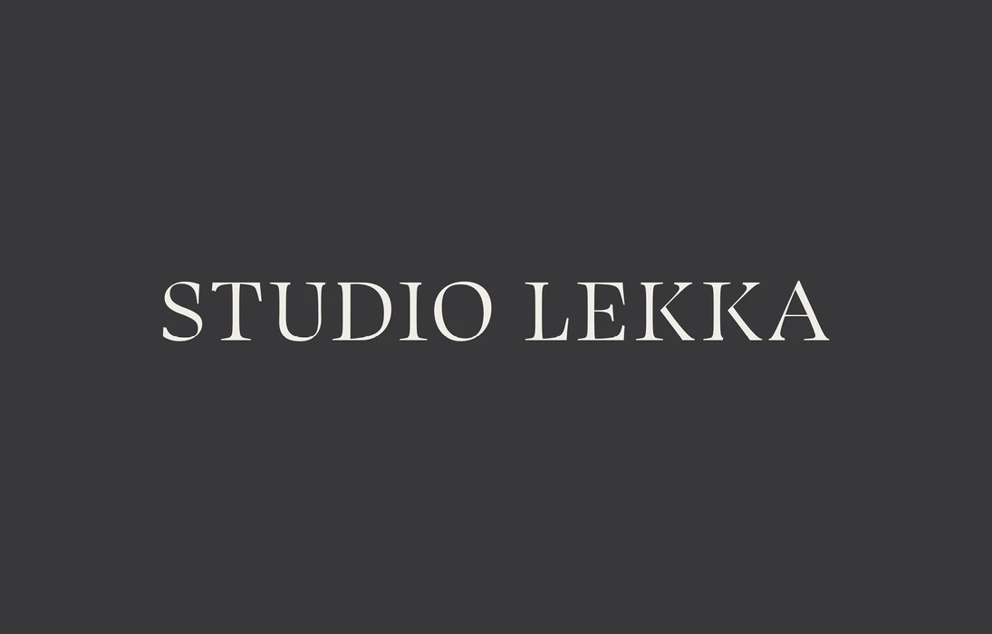 Off-white serif wordmark reading STUDIO LEKKA centered on a solid dark charcoal grey background.